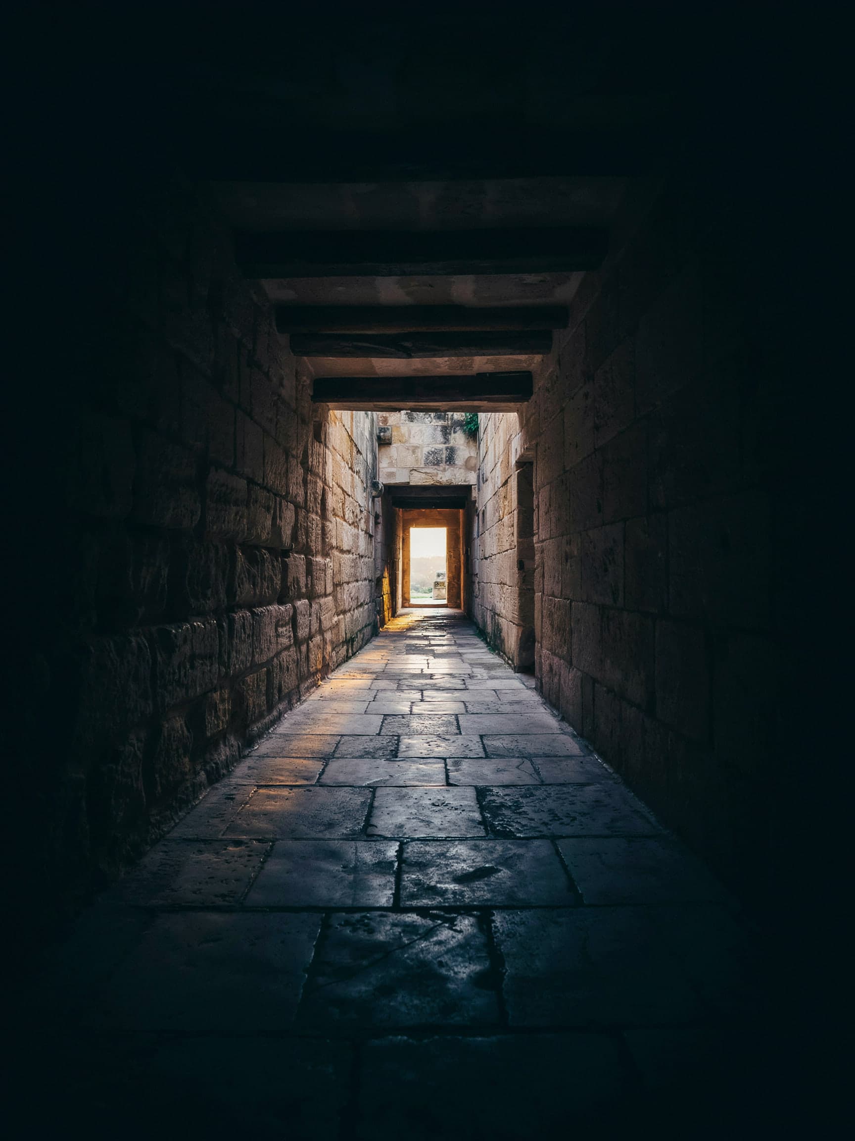 A dark stone passage and, at its end, a doorway of first light.