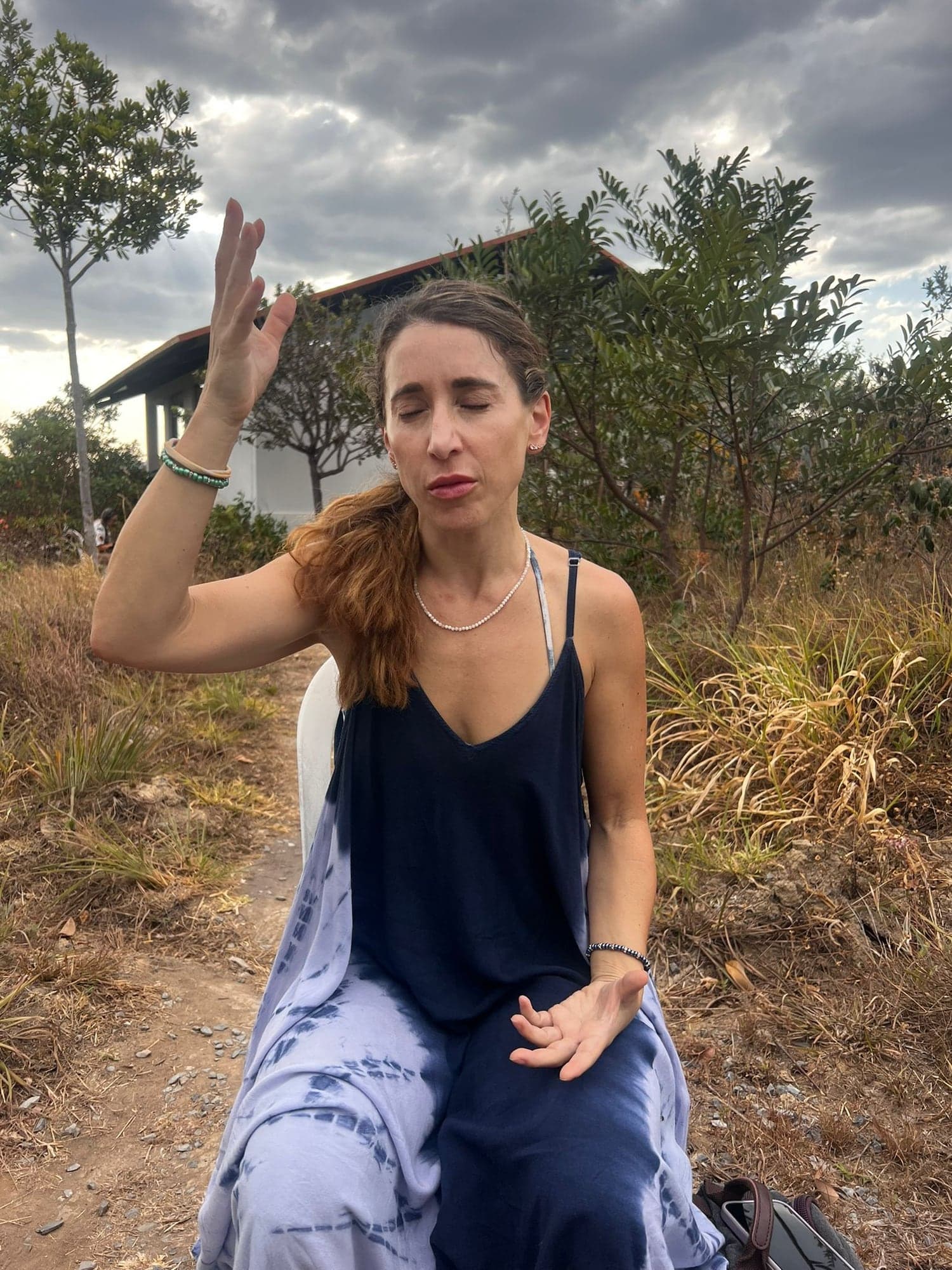 One hand raised as I read the field, the storm gathering behind me.